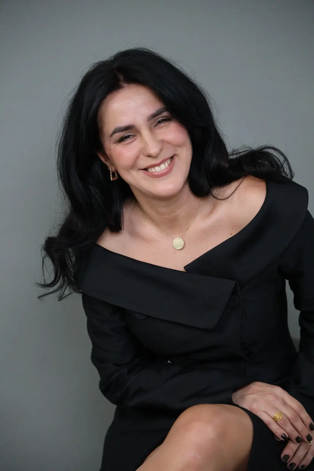 Professional portrait of Adisa, certified life coach with warm smile